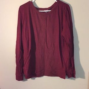 A maroon red long sleeve shirt.